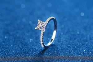Macro detail of a 1 carat princess cut moissanite ring in S925 sterling silver