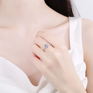 S925 sterling silver ring with emerald cut moissanite gemstone worn on a model hand