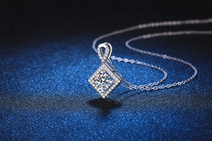 Macro detail of square halo moissanite pendant with micro-pave diamonds on s925 silver chain