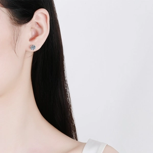 Elegant S925 sterling silver stud earrings with sparkling round moissanite on ear