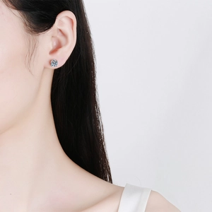 Classic round 4-claw Moissanite stud earrings in S925 sterling silver on model