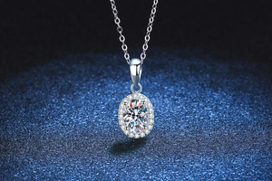 Macro detail of oval cut moissanite pendant with halo setting on S925 silver chain