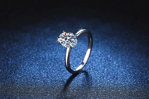 Macro detail of 2 carat oval moissanite ring with hidden halo and 4-prong S925 setting