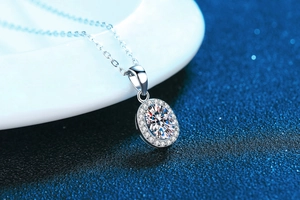 Macro shot of oval moissanite pendant necklace with sparkling halo on elegant backdrop