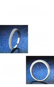 Macro detail of the silver s925 moissanite band ring showing precision settings and polish