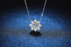 Detailed macro view of the 1-carat moissanite snowflake pendant with silver flower petals