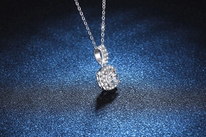 Macro shot of S925 silver halo pendant necklace with a 1ct Moissanite center stone
