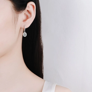 S925 sterling silver moissanite drop earrings with classic oval halo setting on model