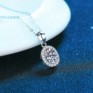 Oval cut moissanite halo pendant in S925 sterling silver with a delicate cable chain