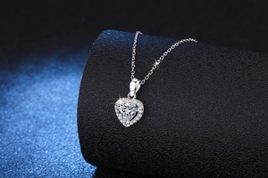 Macro shot of S925 sterling silver heart pendant with shimmering 1ct moissanite halo