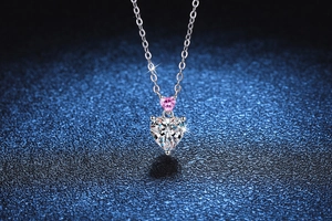 Macro shot of double heart pendant with pink and white stones in S925 silver
