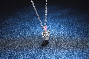Macro detail of S925 silver necklace with heart-shaped D color moissanite pendant