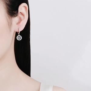 Elegant S925 sterling silver drop earrings featuring 0.5ct Moissanite on Asian model