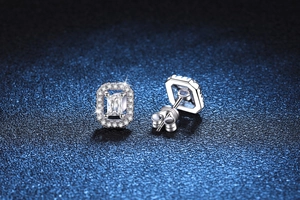 Macro detail of S925 sterling silver rectangular moissanite studs with halo setting