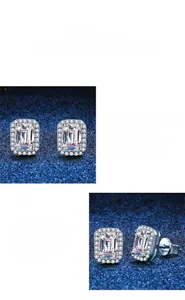 Macro view of S925 sterling silver earrings featuring radiant emerald cut moissanite halo