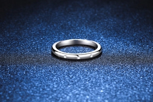 Macro detail of S925 sterling silver ring featuring three round moissanite stones