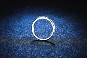 Detail of s925 silver moissanite ring with sparkling stones on dark blue starlight background