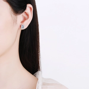 Radiant cut moissanite stud earrings in S925 sterling silver worn by a model