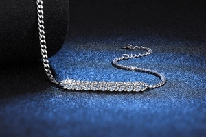 Macro shot of S925 silver Cuban chain bracelet with brilliant Moissanite stone inlay
