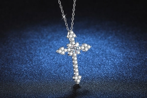 Close-up of S925 silver cross pendant necklace with sparkling moissanite stones