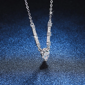 Elegant S925 silver necklace with a sparkling pear-shaped moissanite pendant on blue background