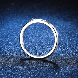 Elegant s925 silver moissanite band ring with sparkling stones on a blue starry background
