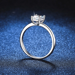 S925 sterling silver ring with emerald cut D color 1 carat moissanite on blue background