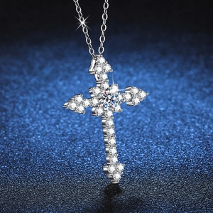 Luxurious S925 sterling silver cross pendant necklace with sparkling moissanite on dark background