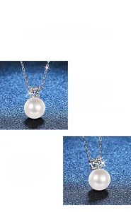 Detail of s925 silver necklace featuring a round white pearl and moissanite pendant