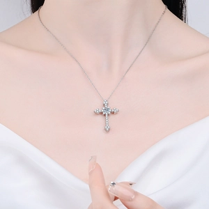 S925 sterling silver cross pendant necklace with moissanite stones worn by a model
