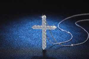 Macro shot of S925 sterling silver cross pendant with 1.6 carat D-color moissanite stones