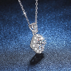 Sparkling S925 silver necklace with a 1-carat D color Moissanite pendant on a blue background
