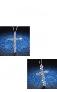 Macro detail of cross pendant featuring pavé-set moissanite and polished 925 silver finish