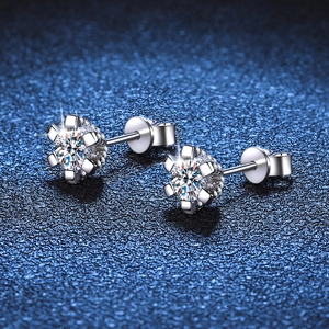 Classic 925 sterling silver six-prong moissanite stud earrings on deep blue background