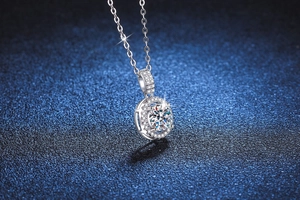 Macro detail of round halo moissanite pendant with sparkling micro-pave setting