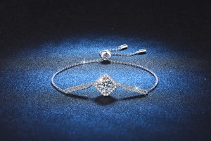 Macro view of adjustable S925 silver bracelet with sparkling moissanite cluster setting