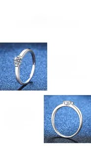 Close-up of S925 sterling silver moissanite ring with six-prong setting and polished band