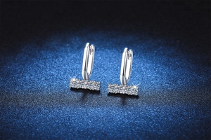 Close-up of S925 silver U-shaped earrings featuring rectangle bars with four round stones