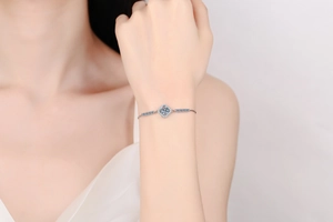 Close-up of S925 sterling silver halo bracelet with sparkling 1ct moissanite on wrist