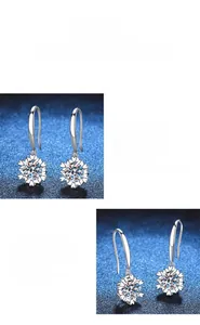 Detail view of snowflake moissanite earrings with 1-carat round brilliant cut stones