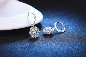 Macro shot of S925 silver flower earrings featuring 1ct Moissanite in luxury jewelry style