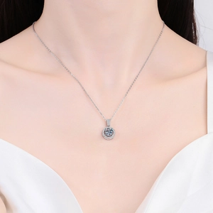 S925 sterling silver necklace featuring 1 carat Moissanite halo pendant on female model