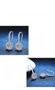 Detailed macro view of polished S925 sterling silver Moissanite halo drop earrings