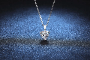 Close-up of S925 silver necklace featuring a sparkling 1-carat heart-cut moissanite stone