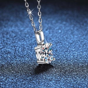 S925 sterling silver necklace featuring 1 carat D color moissanite pendant on blue background