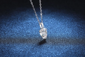 Macro shot of a pear-cut 1 carat Moissanite pendant on a S925 sterling silver chain