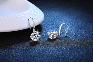 Macro detail of S925 sterling silver earrings with four-prong set round moissanite