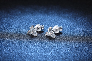 Macro detail of S925 sterling silver three-stone cluster moissanite stud earrings