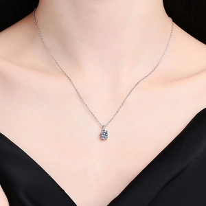 Classic S925 silver necklace with a 1-carat round moissanite pendant on a model