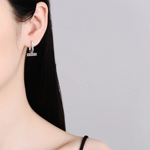 Luxurious S925 sterling silver U-shaped moissanite earrings for women on model